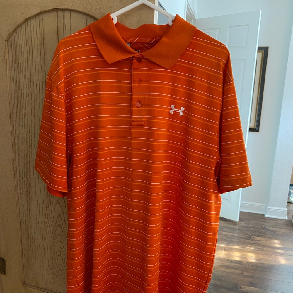 Under Armour golf shirt.